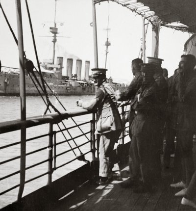 Transport with the Old Contemptibles from India meets a man-of-war in the Mediterranean by English Photographer